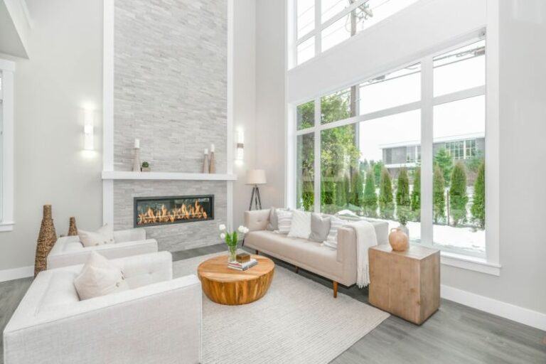 Luxury Real Estate - white couch near glass window