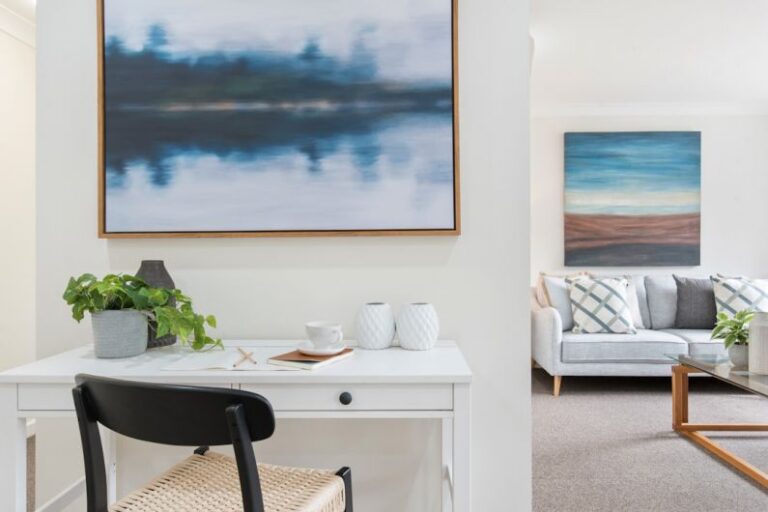 Rental Property - white and black table with chairs near body of water painting