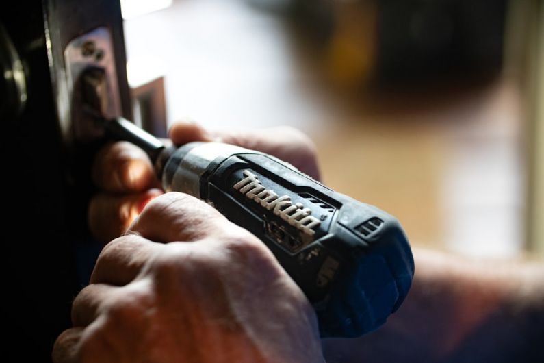 Contractors - selective focus photography blue and black Makita power drill