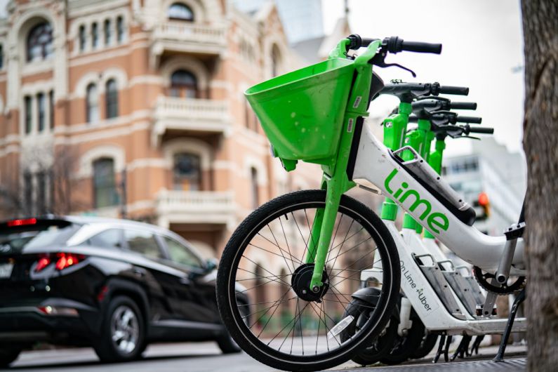 Short-Term Rentals - a green bike parked on the side of a street